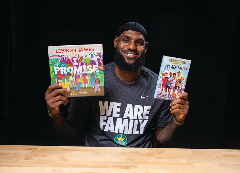 LeBron James with books he authored